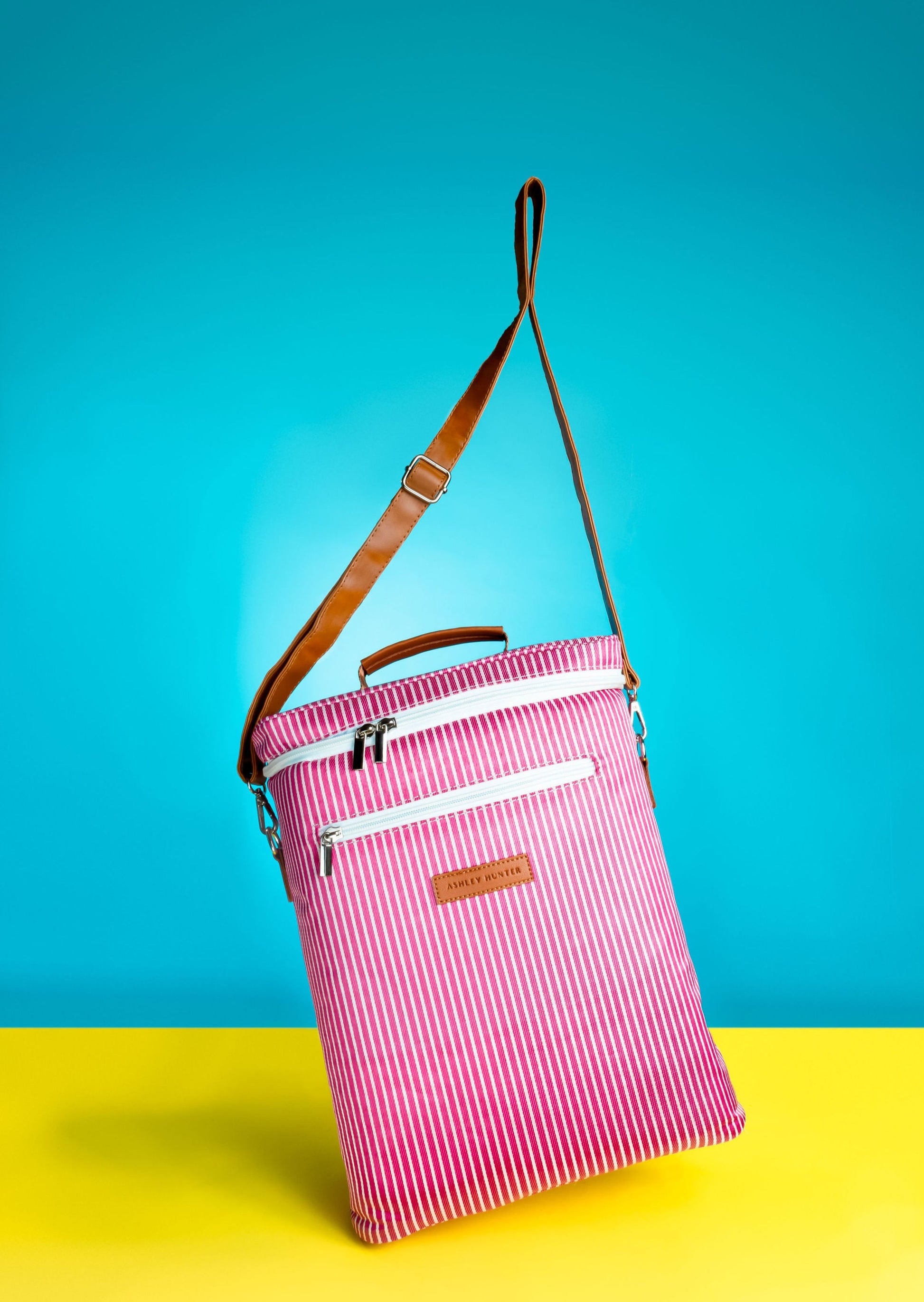 Ashley Hunter No. 16 is an effortless classic in pink pinstripes with a straddle stop and front pocket for your accessories. 